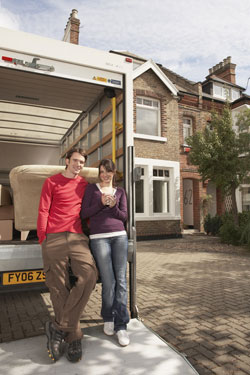 Happy couple moving house